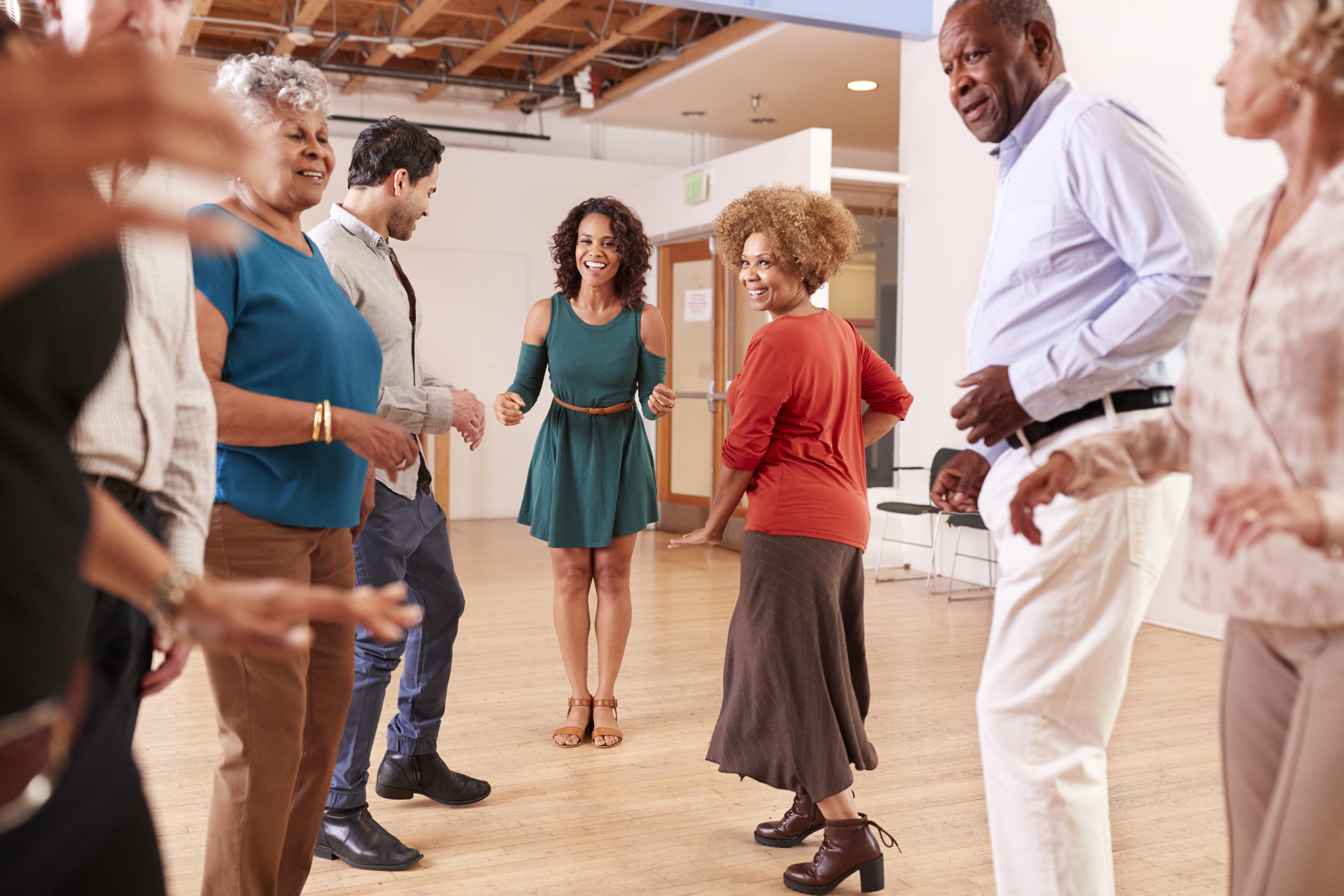 People Attending Dance Class In Community Center